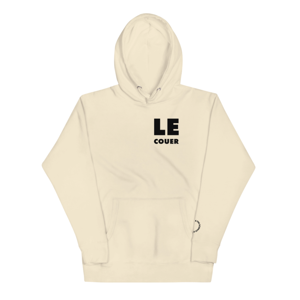 Cream-colored pullover hoodie with a hood and kangaroo pocket, bold black text reading LE above smaller COUER on the left chest and a small black circular logo near the lower right pocket.
