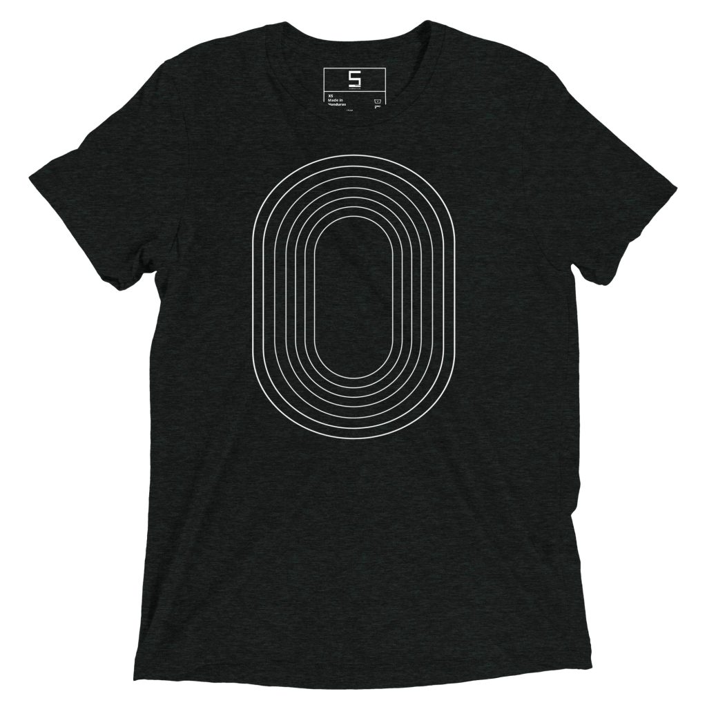 Dark charcoal heather crew-neck t-shirt with short sleeves featuring a white multi-line concentric elongated oval (track-like) design centered on the chest and a small printed size tag at the inside back collar.